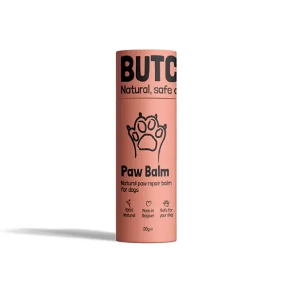 Envase cilíndrico verde claro de Heal Balm, un bálsamo natural para la reparación de heridas en perros. El diseño muestra un perro con un vendaje y los iconos indican que es 100% natural, hecho en Bélgica y seguro para los perros.